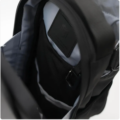 Black ShakeMix gym bag with exterior shaker bottle holder and spacious compartments for workout gear and accessories.